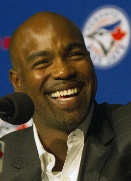 New York Mets first baseman Carlos Delgado, right, smiles after he